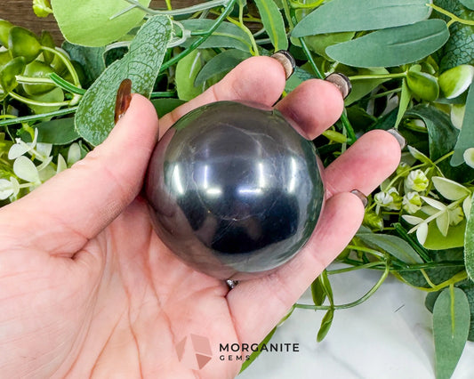 54mm Polished Shungite Sphere – High-Carbon Grounding Stone & EMF Protection Decor - Metaphysical Crystals