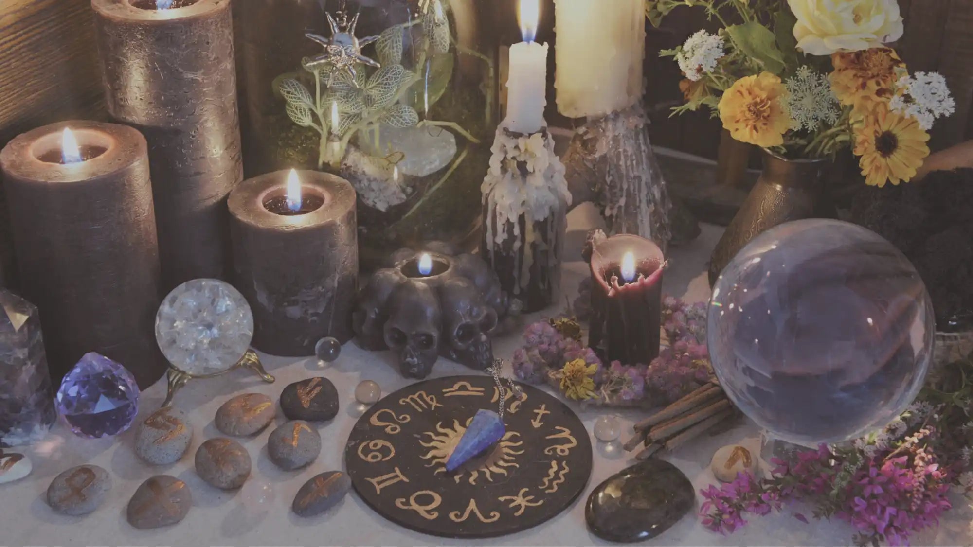A collection of mystical tools and candles.