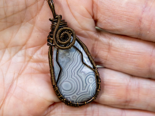 Wire-Wrapped Agate with Gray and White Patterns and Bronze Necklace